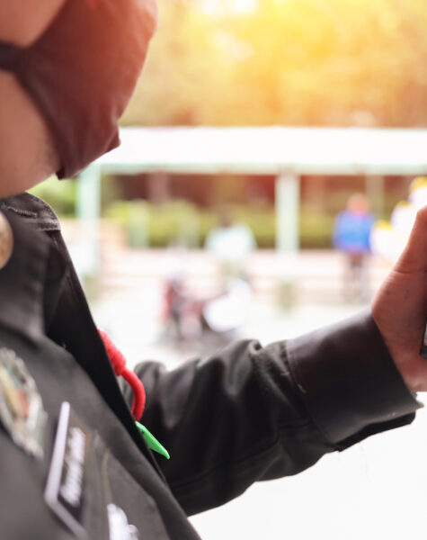 Security,Guard,Wearing,Mask,And,Use,Walkie,Talkie,To,Maintain
